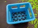 Blue empty crate side view